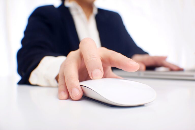 A corporate woman scrolling her mouse